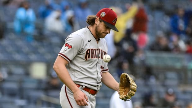 Arizona Damondbacks right-hander Kevin Ginkel (37) reacts in frustration after walking in the tying run against the New York Yankees.